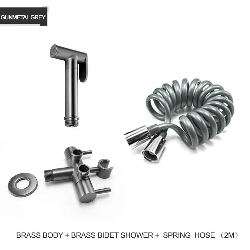 Modern gold brass bidet shower head with double valve and gunmetal grey coiled spring hose for bathroom use