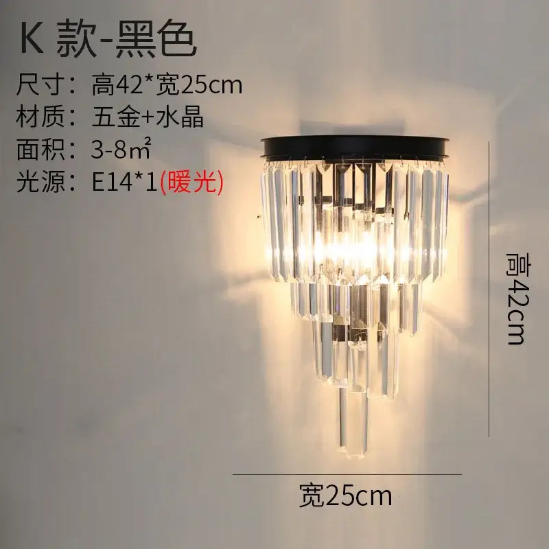 Modern gold brass crystal wall sconce with black metal frame and tiered cascading clear glass prisms for decorbites crystal modern wall design