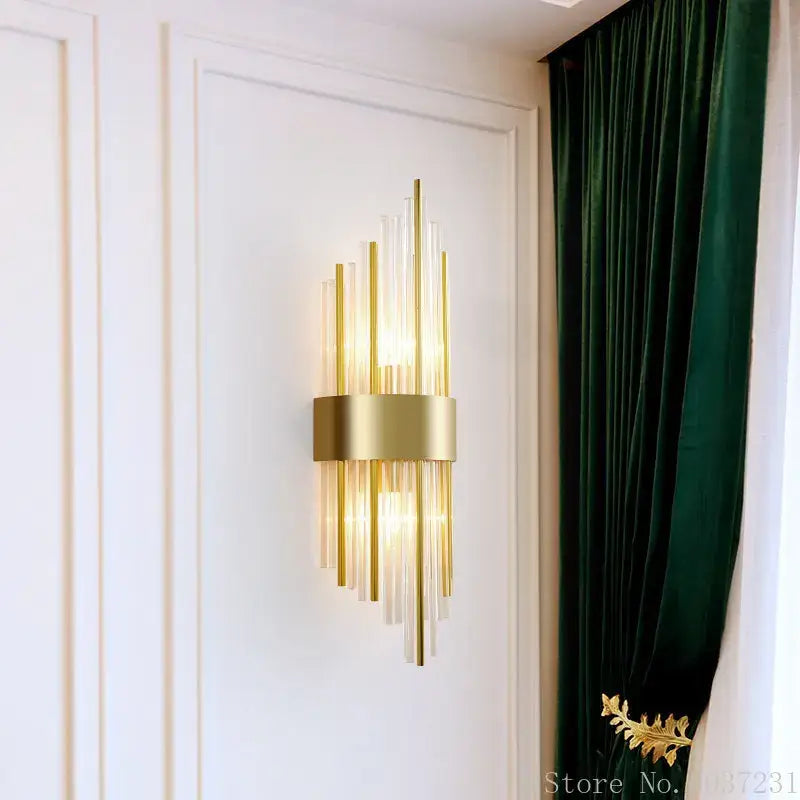 Modern gold brass crystal wall sconce with vertical glass rods and central metallic band for bedroom decorbites crystal modern use