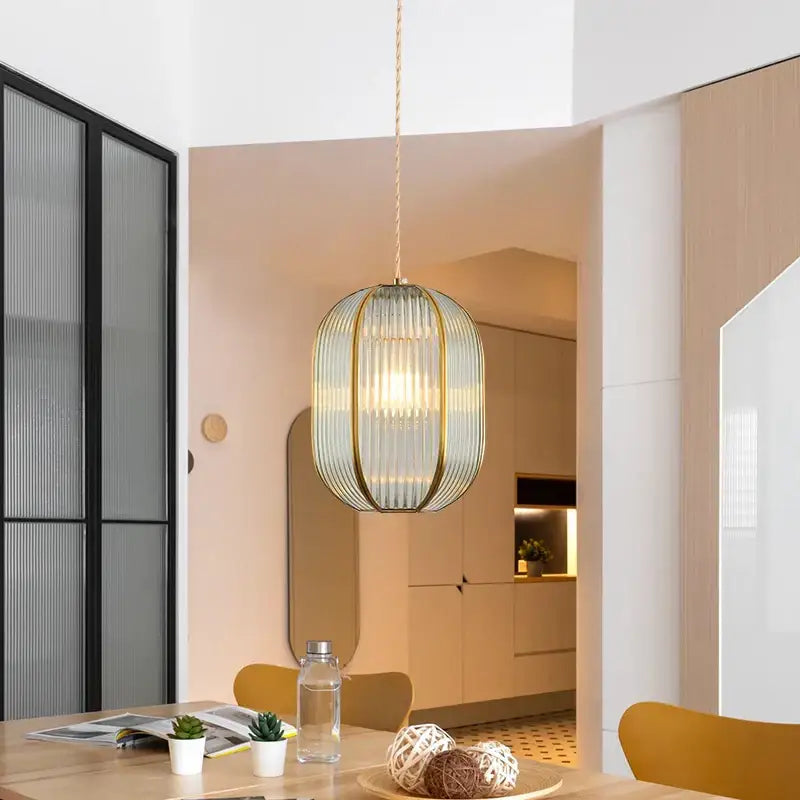 Modern gold brass glass restaurant light with translucent ribbed glass and slender gold-toned metal decorbites brass glass chandelier