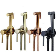 Four wall-mounted bidet sprayers in gold brushed brass rose gold and black with metallic bodies and flexible hoses
