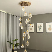 Modern gold bubble crystal ceiling pendant light with circular mount and dangling crystal spheres for villa staircase decorbites bubble crystal