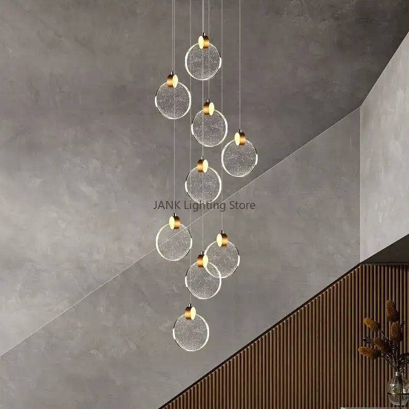 Modern gold bubble crystal ceiling pendant light with glass sphere and gold metal accents for villa staircase decorbites