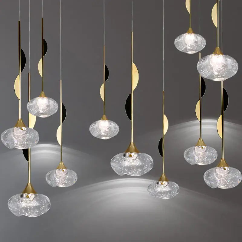 Elegant gold-toned decorbites bubble crystal pendant light with textured translucent glass globes for dining room decor