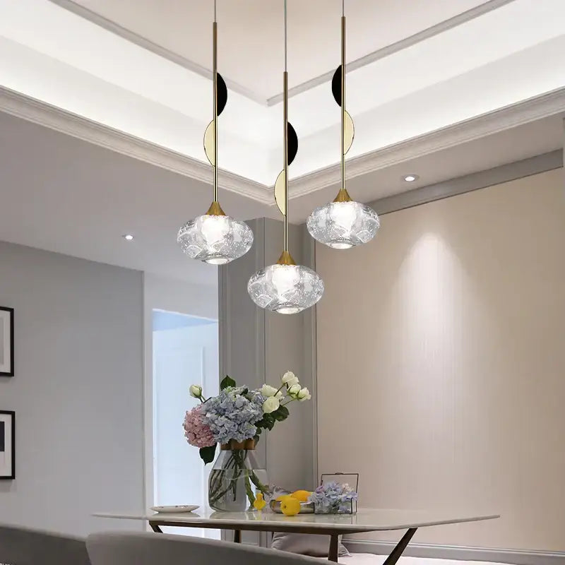 Three elegant modern gold bubble crystal pendant lights with textured clear glass shades for dining room decorbites bubble crystal pendant