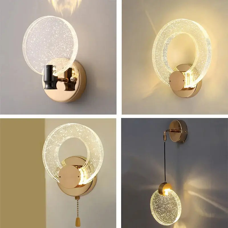 Modern gold bubble crystal pendant lights with gold-toned circular wall sconce and warm ambient light for living room
