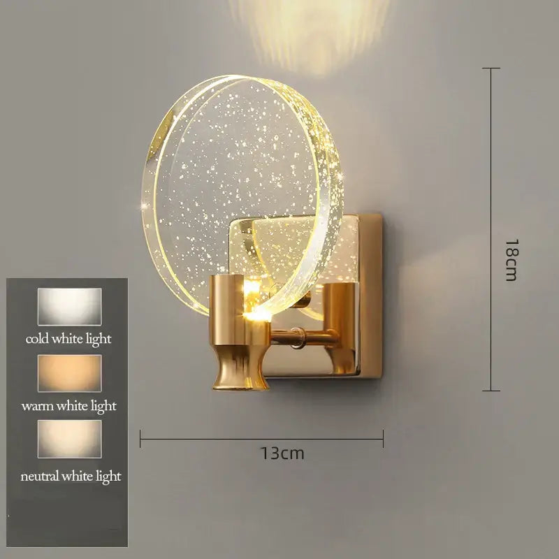 Modern gold bubble crystal pendant lights featuring a gold-toned wall sconce with a clear glass shade and illuminated ring