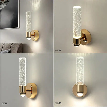 Modern gold bubble crystal wall sconces featuring a gold-toned cylindrical design with clear glass tube and frosted brass base