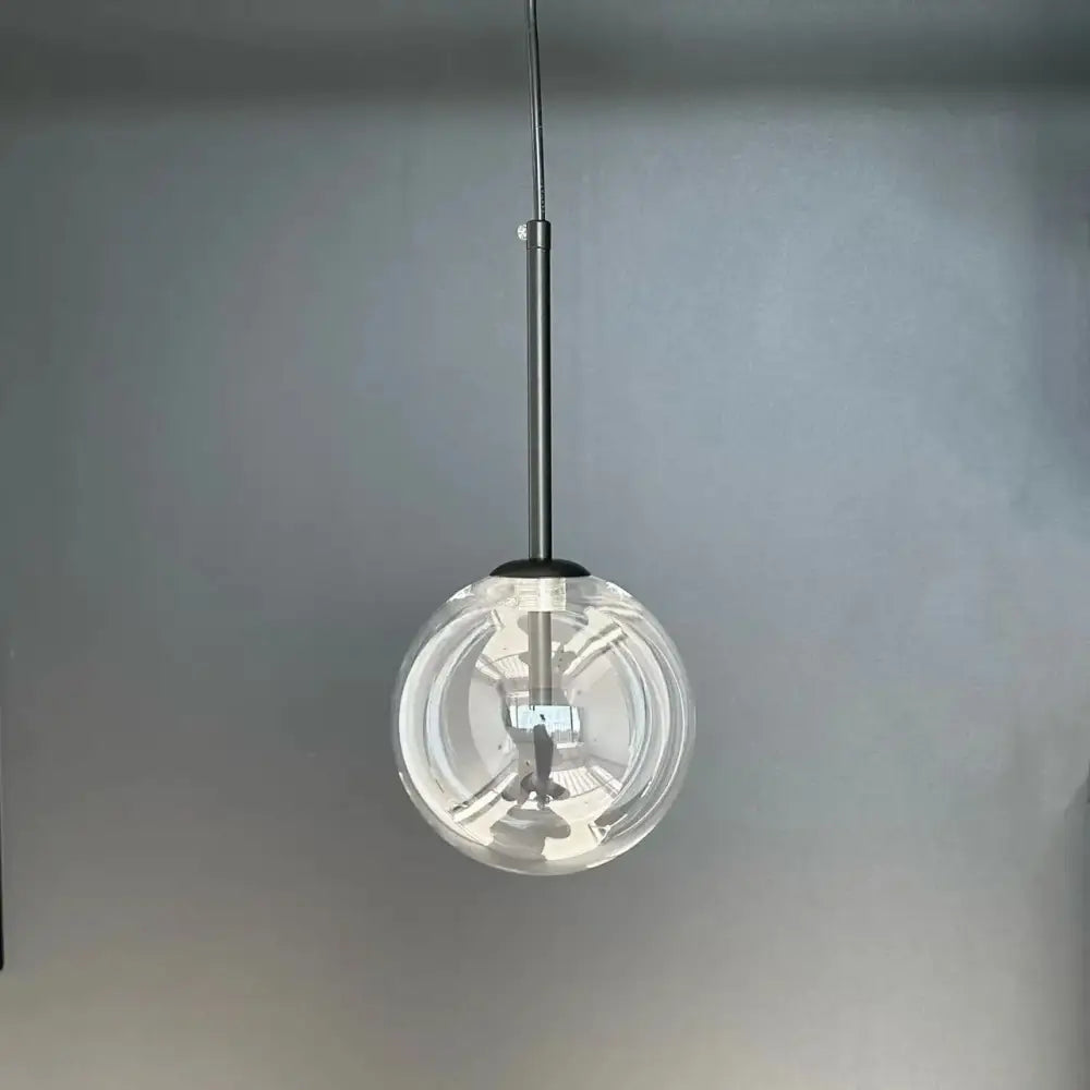 Modern gold bubble glass ball pendant light with clear glass globe and sleek metallic rod for kitchen decorbites pendant light
