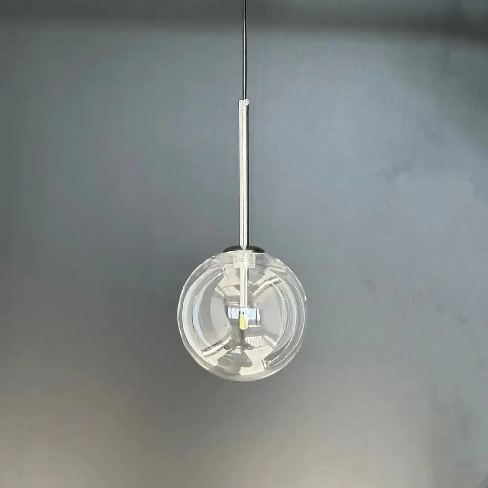 Modern gold bubble glass ball pendant light with clear glass globe and sleek chrome rod for kitchen decorbites bubble glass