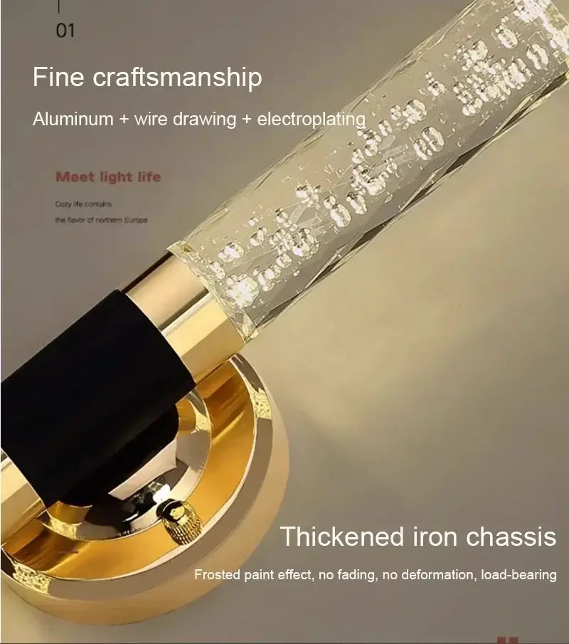 A sleek modern decorbites gold vanity light with a clear glass tube and polished gold aluminum base for bathrooms