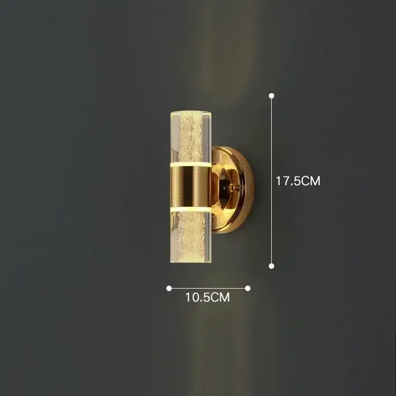 Modern gold vanity light from decorbites featuring a gold-toned wall sconce with textured bubble glass shade and metallic bands