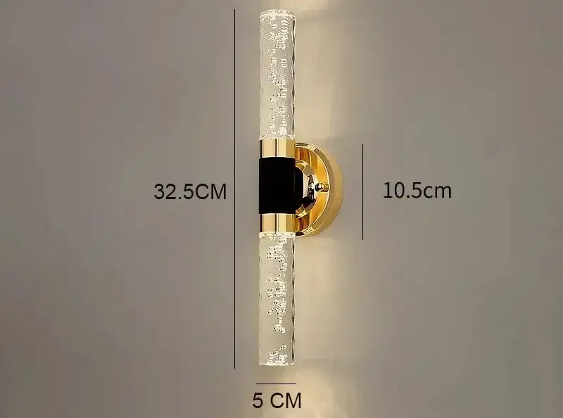 Modern gold bubble glass vanity lights feature gold vanity lights with clear textured glass tubes and a black central decorbites gold accent