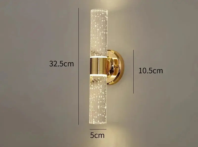 Modern gold bubble glass vanity lights with clear cylindrical glass and gold-toned metal bands by decorbites gold