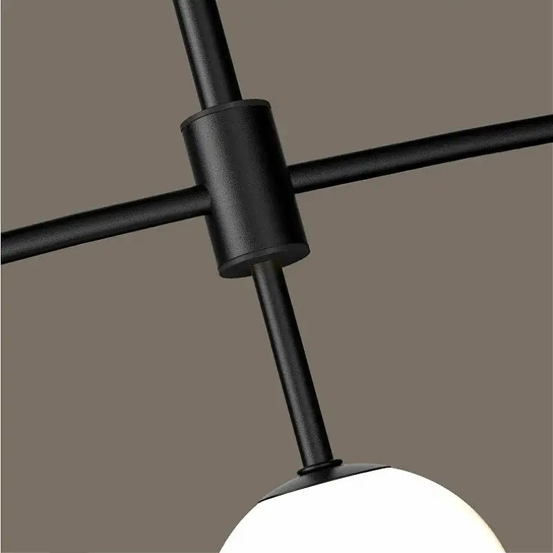 Black metal decorbites bubble iron chandelier with matte finish and white spherical glass shade for modern kitchen decor