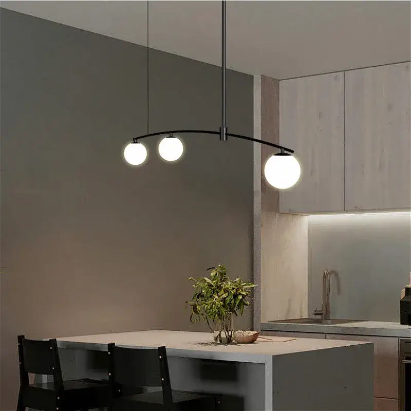 Modern black metal pendant light with three white glass bulbs from decorbites bubble iron chandelier collection