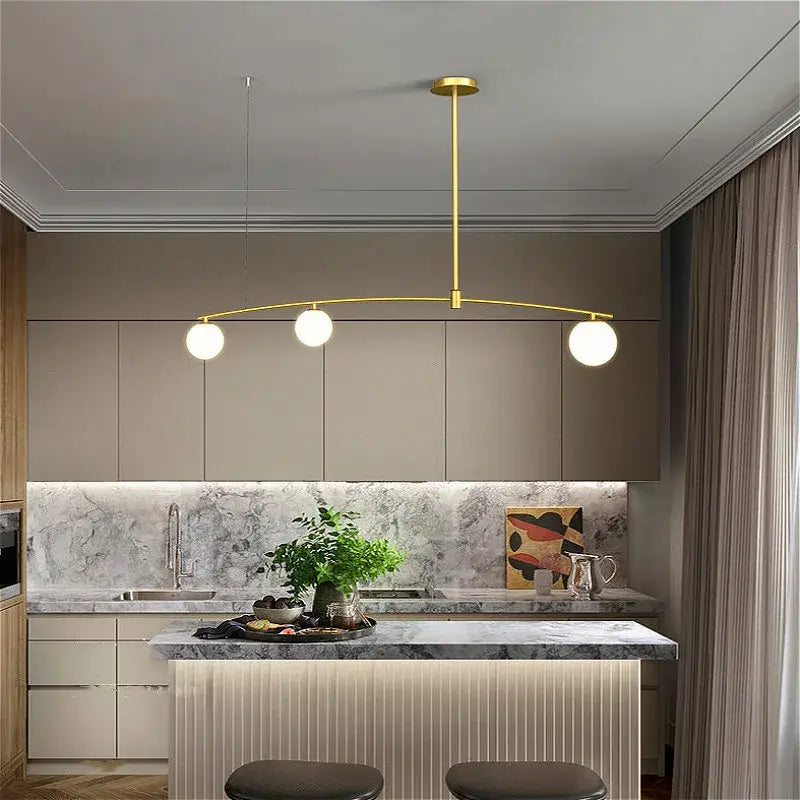 Modern gold bubble iron chandelier kitchen arc pendant light with three spherical bulbs and sleek curved arm by decorbites bubble iron