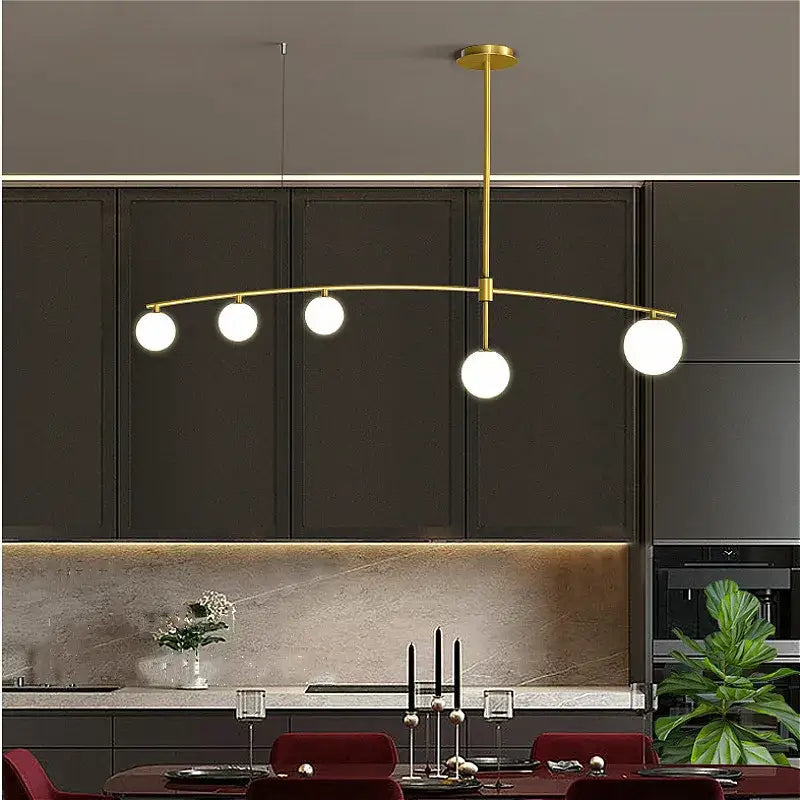 Modern gold bubble iron chandelier with five white glass bulbs arranged in an arc for kitchen decorbites bubble iron lighting