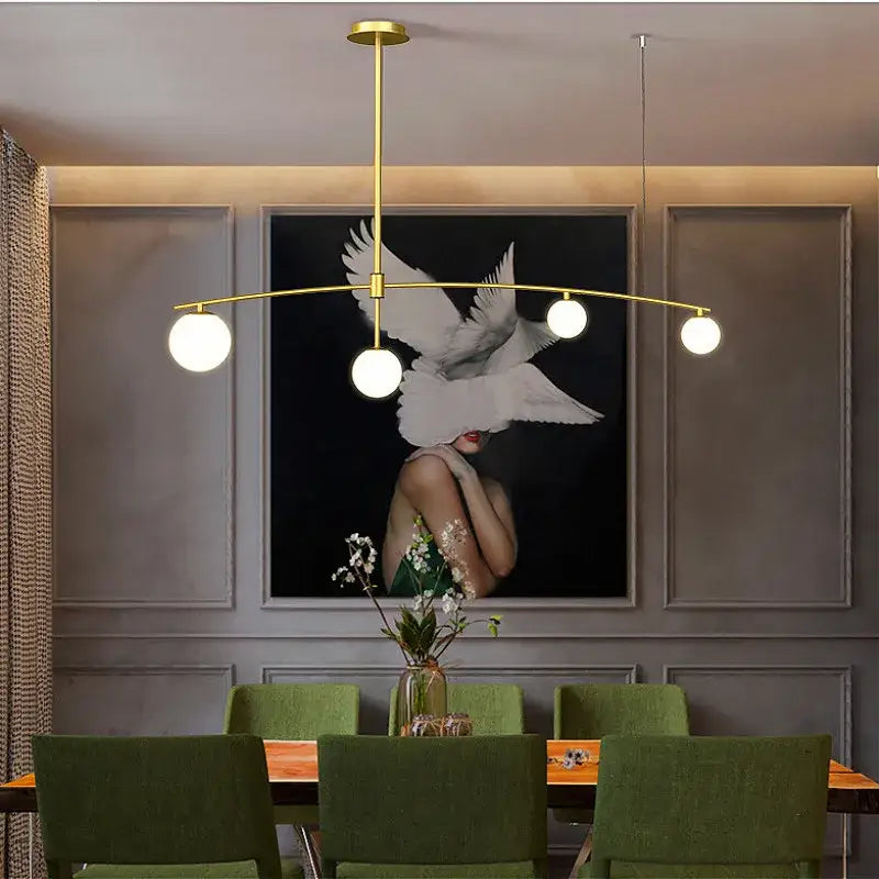 Modern gold bubble iron chandelier with three white spherical bulbs suspended from a sleek horizontal bar for kitchen decorbites bubble iron design