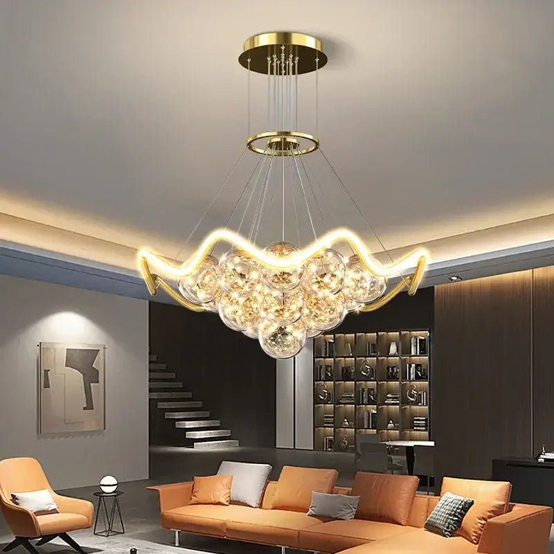 Modern gold bubble pendant chandelier with curved led light arms and clear glass spheres for dining room decorbites bubble pendant