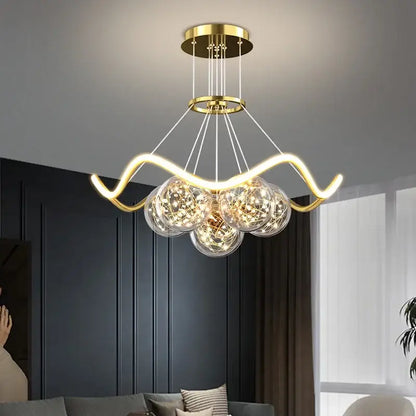 Modern gold bubble pendant chandelier with three clear glass spheres and intricate led lights for dining room decorbites bubble pendant