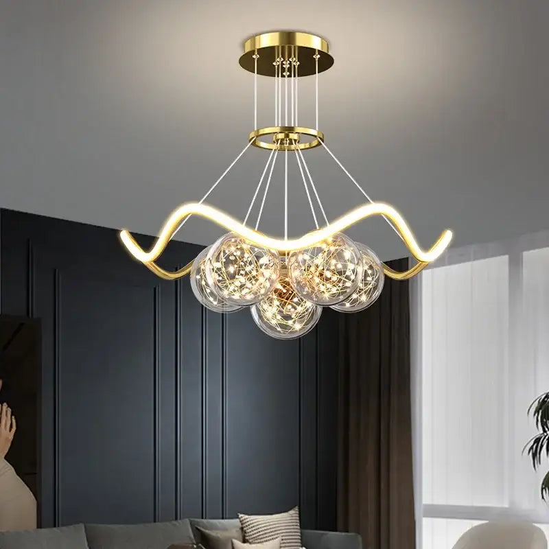 Modern gold bubble pendant chandelier with three clear glass spheres and intricate led lights for dining room decorbites bubble pendant