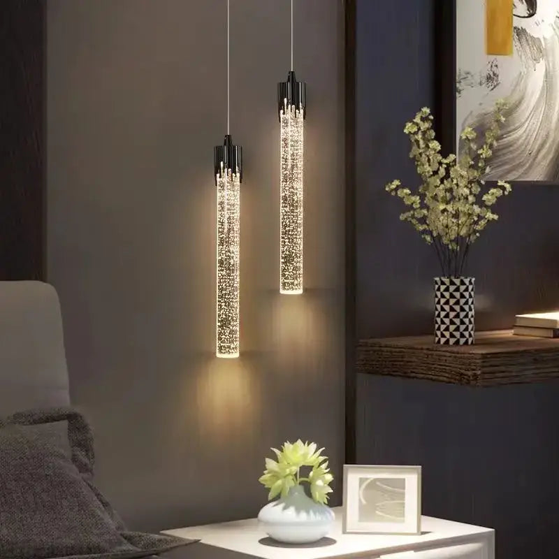 Two sleek black-framed decorbites bubbles crystal pendant lights with sparkling interiors emit warm glow for living room decor