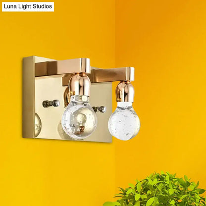 Modern gold bulb shaped crystal wall sconce with brass finish and bubble detail glass globes for 110v-120v bedroom lighting