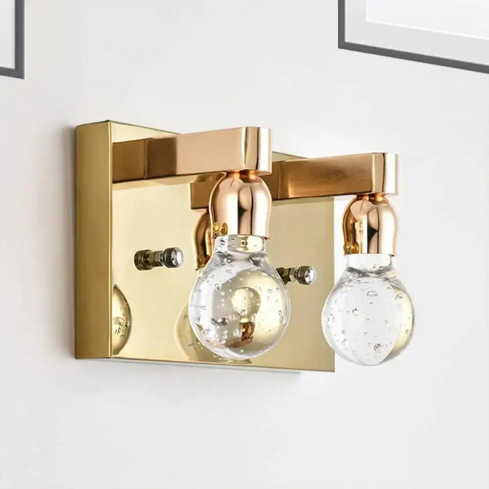Modern gold bulb shaped crystal wall sconce with two clear bubble filled glass bulbs for 110v-120v bedrooms