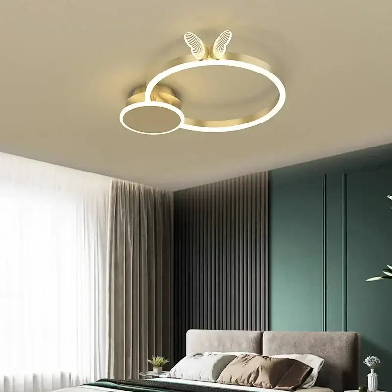Modern gold butterflies ceiling light featuring gold-toned circular design with butterfly wing accents for bedroom decor