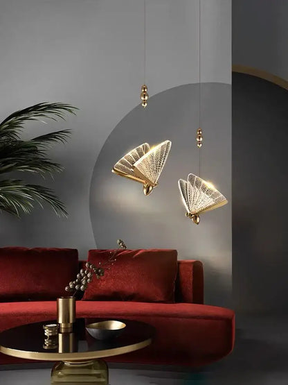 Modern gold butterfly acrylic chandelier featuring gold-finished fan-shaped pendant lights with intricate lattice detailing by decorbites butterfly acrylic