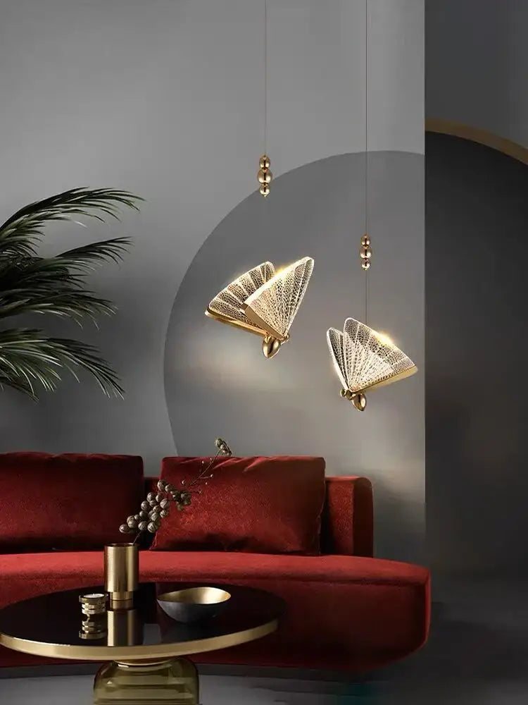 Modern gold butterfly acrylic chandelier featuring gold-finished fan-shaped pendant lights with intricate lattice detailing by decorbites butterfly acrylic
