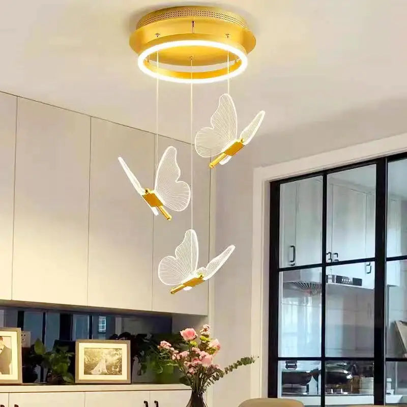 Modern gold butterfly acrylic led chandelier with three translucent white butterfly acrylic led pendants for bedroom decorbites