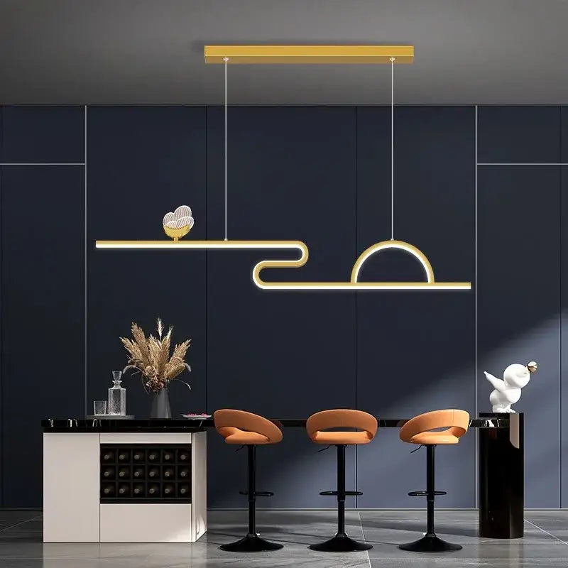 Modern gold-toned decorbites butterfly chandelier pendant light with sleek curved design and decorative heart accent for dining room