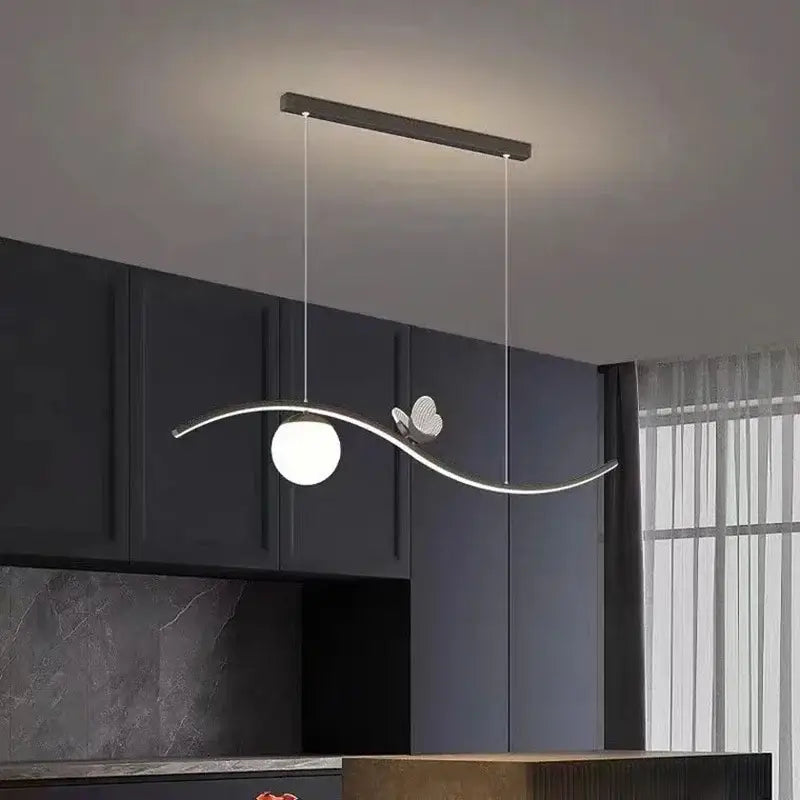 Modern gold decorbites butterfly chandelier pendant lamp with sleek curved metallic frame and spherical white glass bulb