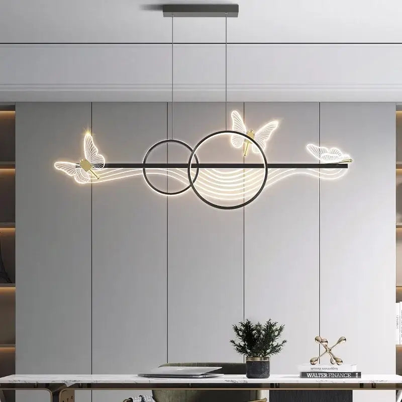 Modern black metal pendant lamp with glowing white butterfly and circular led accents decorbites butterfly chandelier