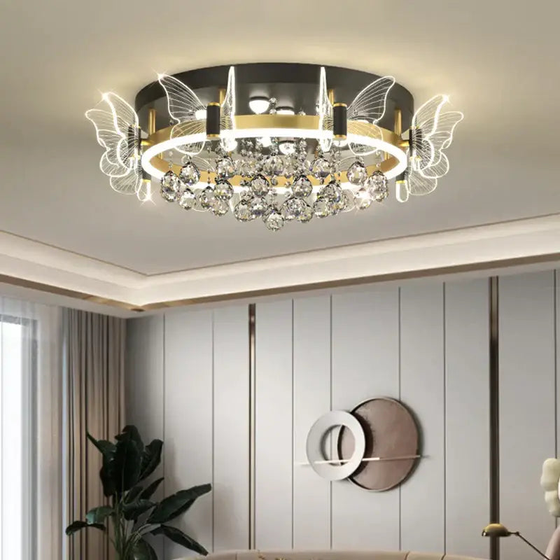 Modern gold butterfly crystal ceiling light with circular design, gold metal accents, and illuminated butterfly led lights
