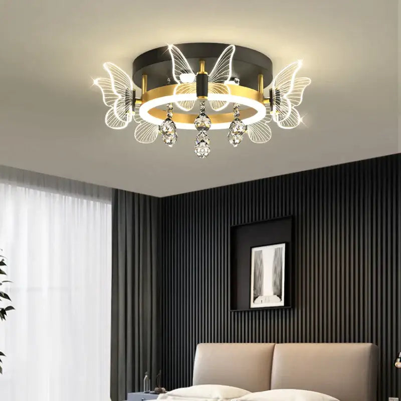 Modern gold butterfly crystal ceiling light with black base and illuminated wing-shaped LED lights for elegant decorbites ceiling lamp