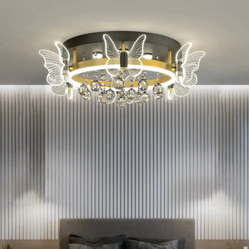 Modern gold butterfly crystal ceiling light with illuminated wings and dangling droplets for bedroom decorbites elegant ceiling lamp