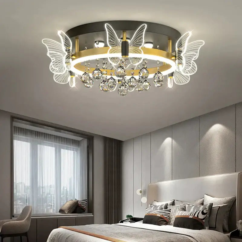 Modern gold butterfly crystal ceiling light with illuminated wings and crystal droplets for elegant bedroom decorbites ceiling lamp