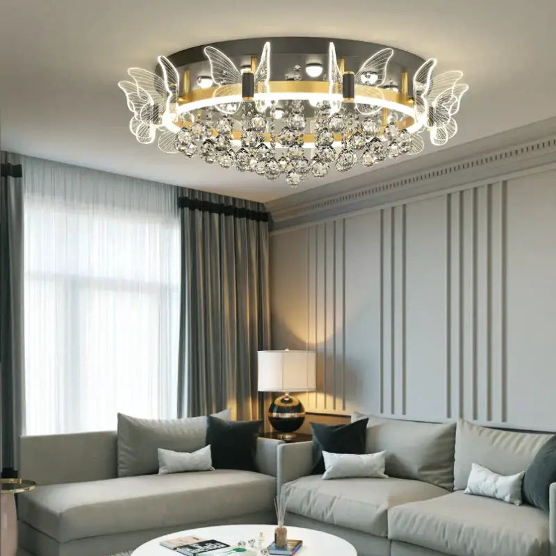 Modern gold butterfly crystal ceiling light featuring intricate butterfly wing designs and dangling crystal droplets for bedroom decorbites elegant butterfly ceiling lamp