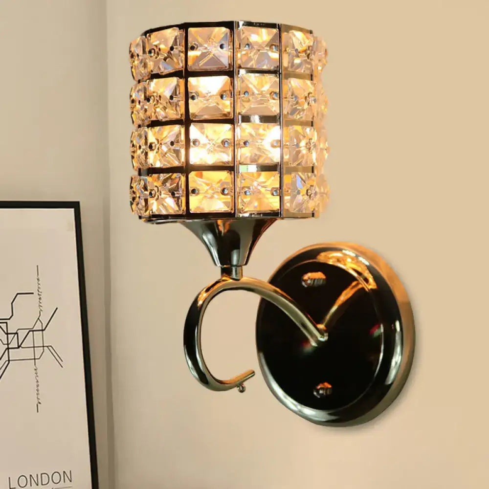 A modern gold butterfly crystal wall light fixture with faceted crystals in a polished chrome cylindrical frame