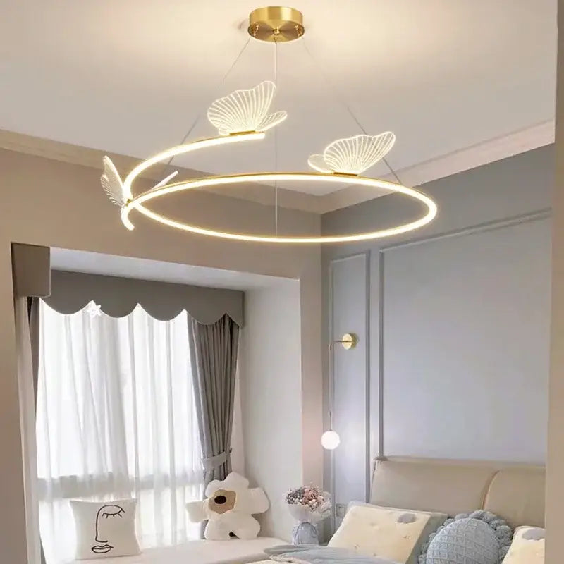 Modern gold butterfly design ceiling chandelier with gold-toned circular led and three illuminated butterfly accents