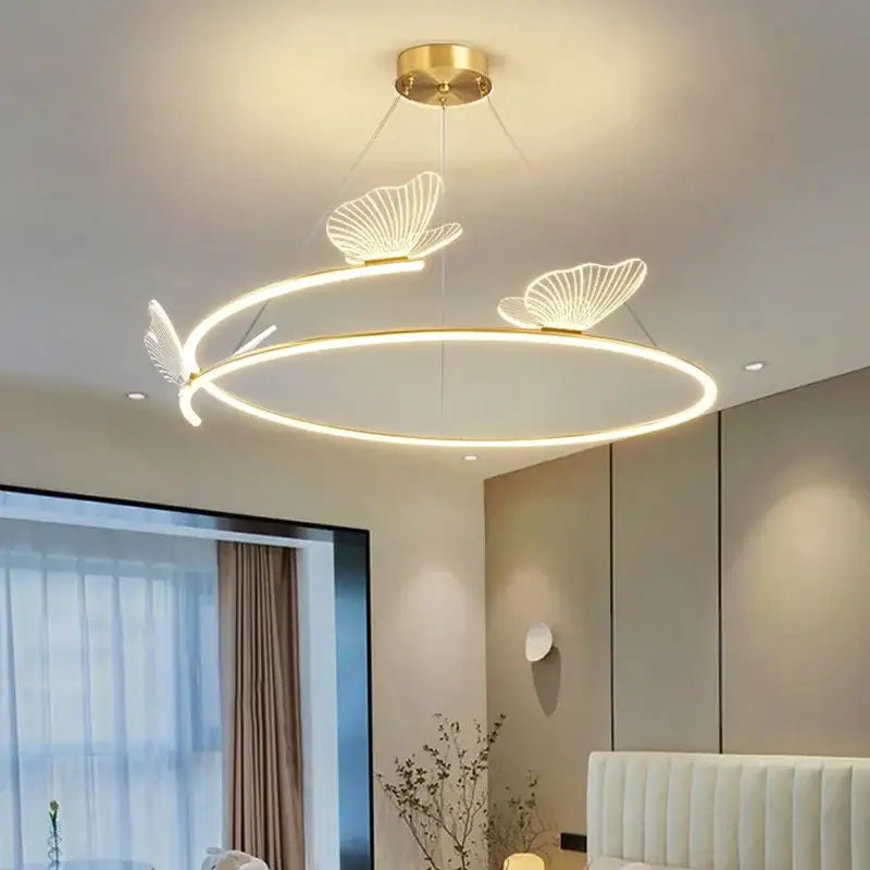 Modern gold ceiling chandelier with decorbites butterfly design sense and brass circular frame for dining room decor