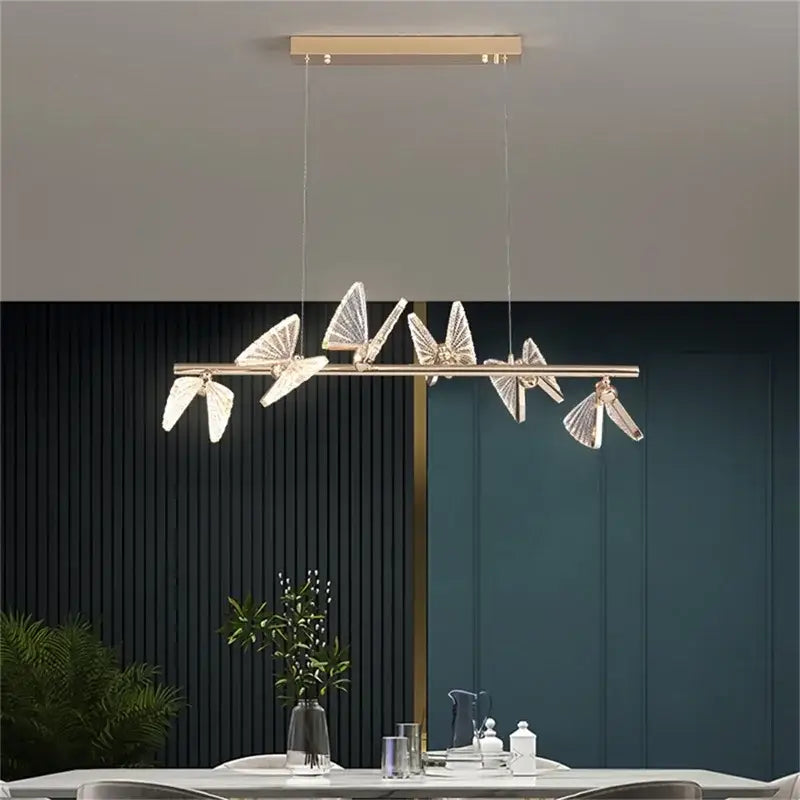 Modern gold butterfly led chandelier with crystal wings and sleek horizontal bar for bedroom decorbites butterfly led design