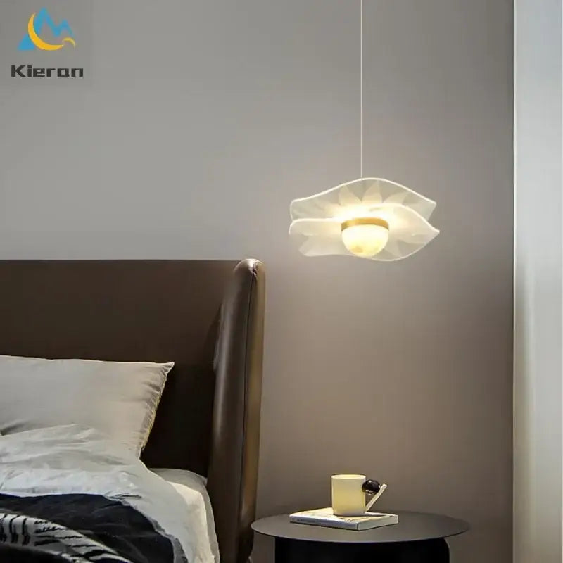 A delicate white glass butterfly led chandelier pendant light with a warm gold center for dining room decorbites butterfly led