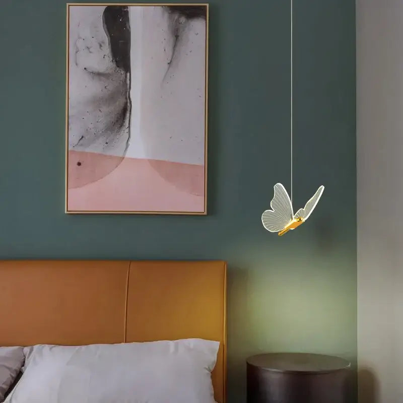 Modern gold butterfly led hanging lamp with translucent glowing wings and golden body for bedroom decorbites butterfly led