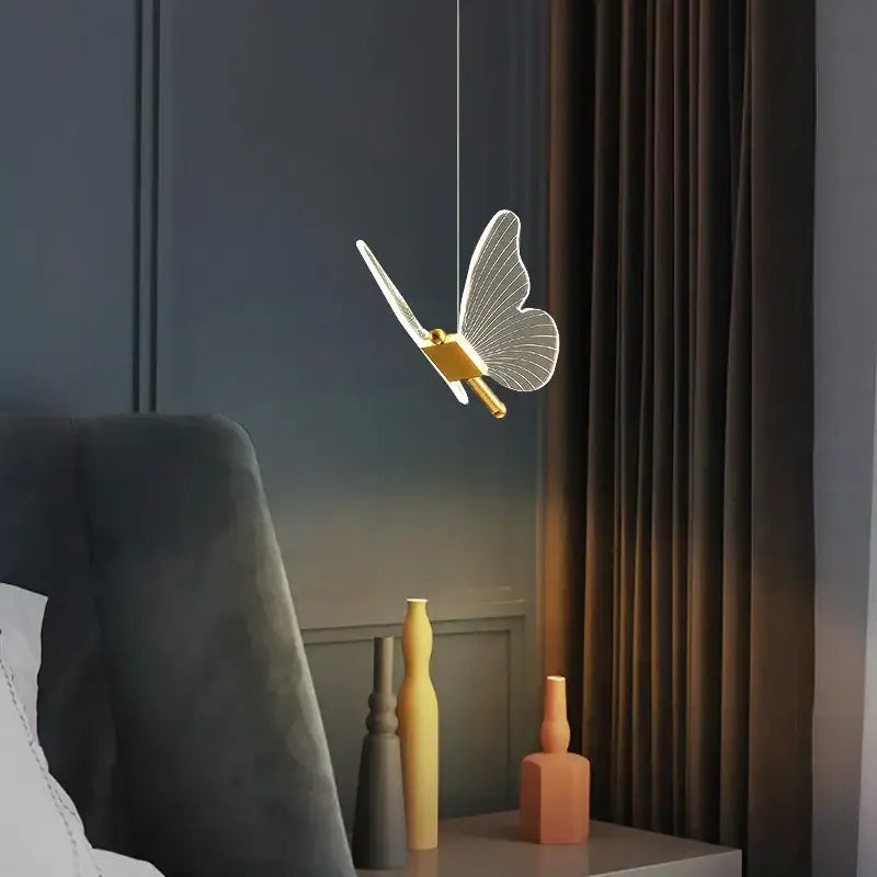 Modern gold butterfly led hanging lamp with delicate translucent wings and intricate gold-toned body for bedroom decorbites butterfly led