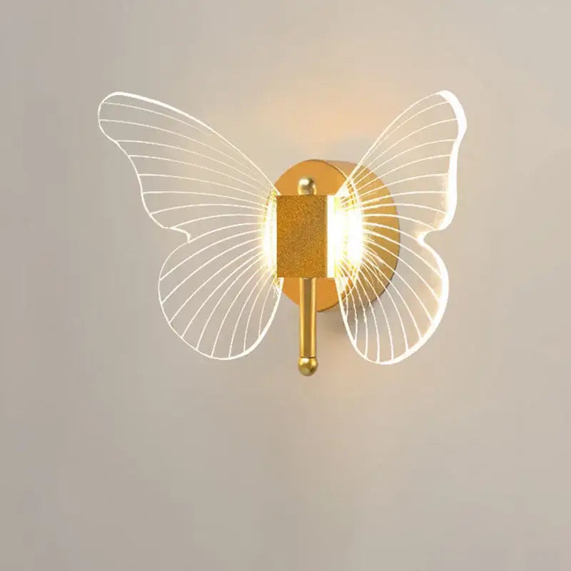 Modern gold butterfly nordic led wall lamp with translucent wireframe wings and glowing central light for decorbites wall lamp