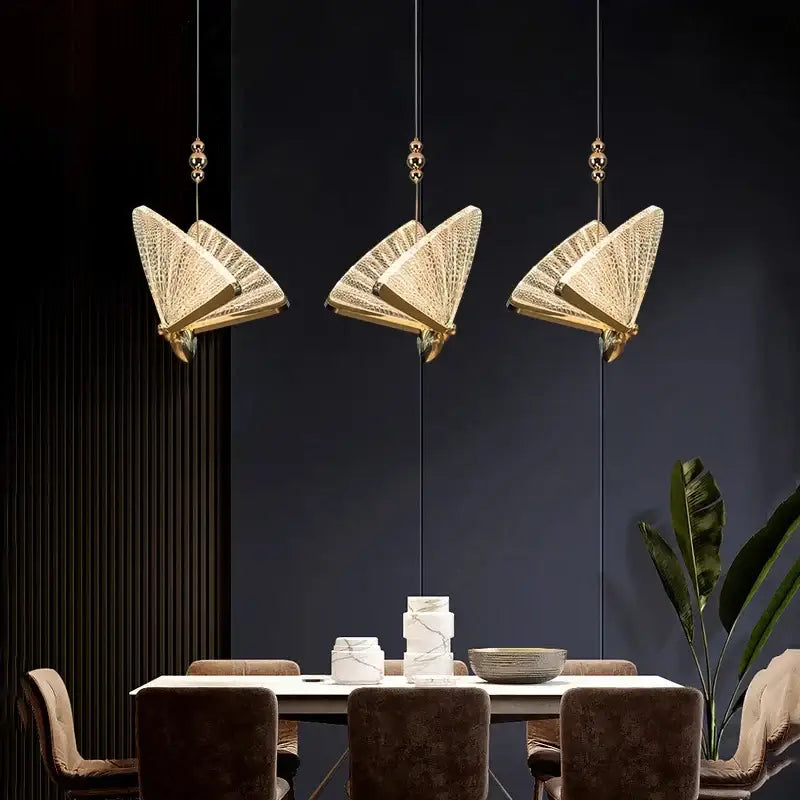 Three elegant modern gold butterfly pendant lamps with intricate woven mesh decorbites butterfly pendant lighting fixtures